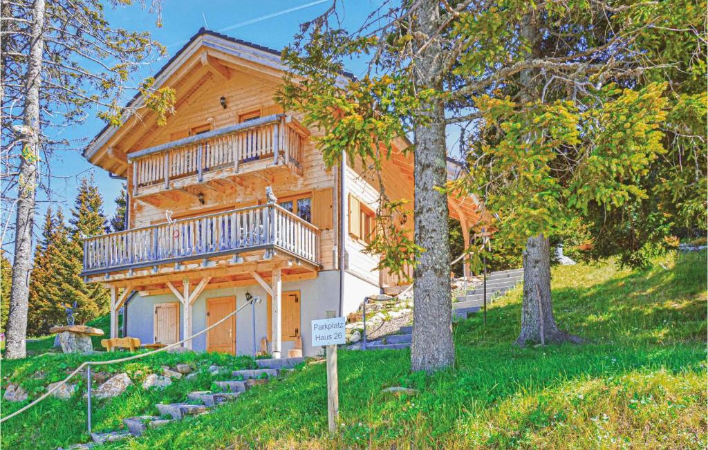 a log house with a balcony on a hill at Stunning Home In St, Stefan With 3 Bedrooms And Sauna in Elsenbrunn