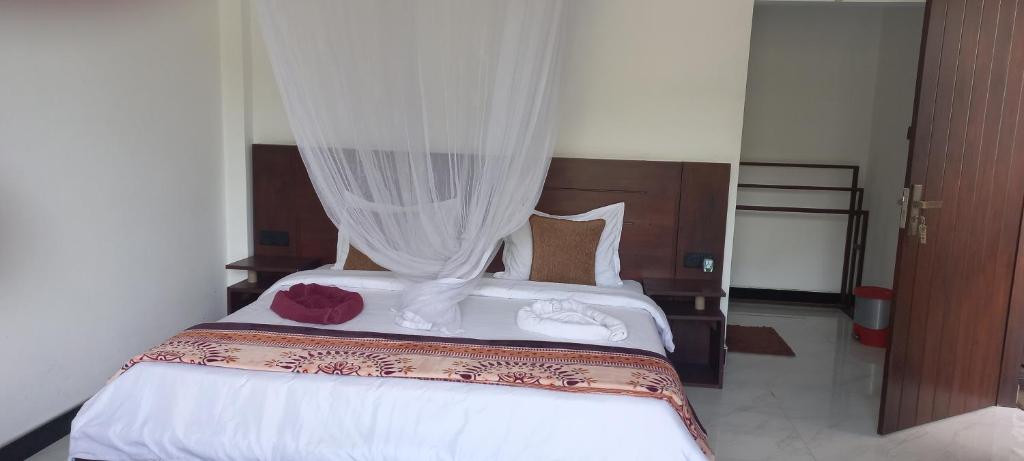 Postel nebo postele na pokoji v ubytování Ella Odyssey Inn