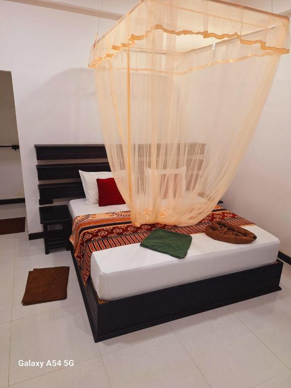 Postel nebo postele na pokoji v ubytování Ella Odyssey Inn