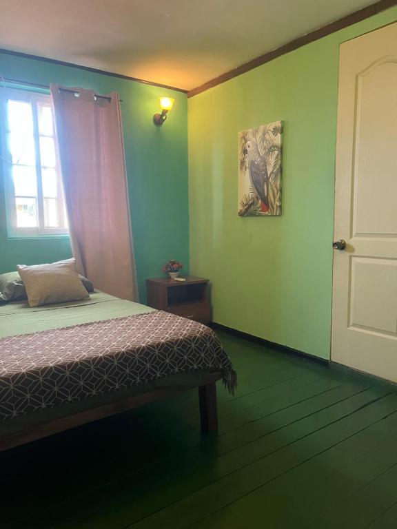 A bed or beds in a room at Hostal Cay