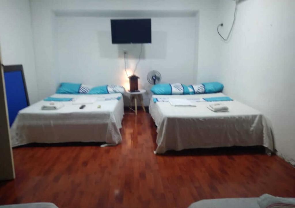 Voodi või voodid majutusasutuse Casa hotel Mi Huila toas