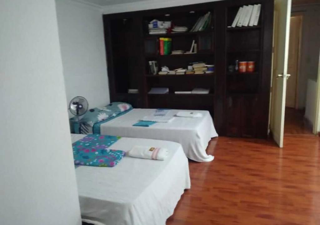 Voodi või voodid majutusasutuse Casa hotel Mi Huila toas