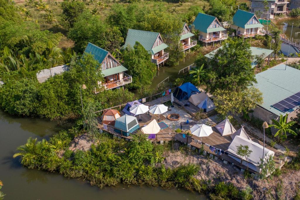 an aerial view of a resort on a river at Kampot Eco Village in Kampot