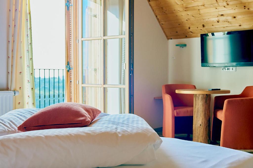 Postel nebo postele na pokoji v ubytování Winzerzimmer Scharl