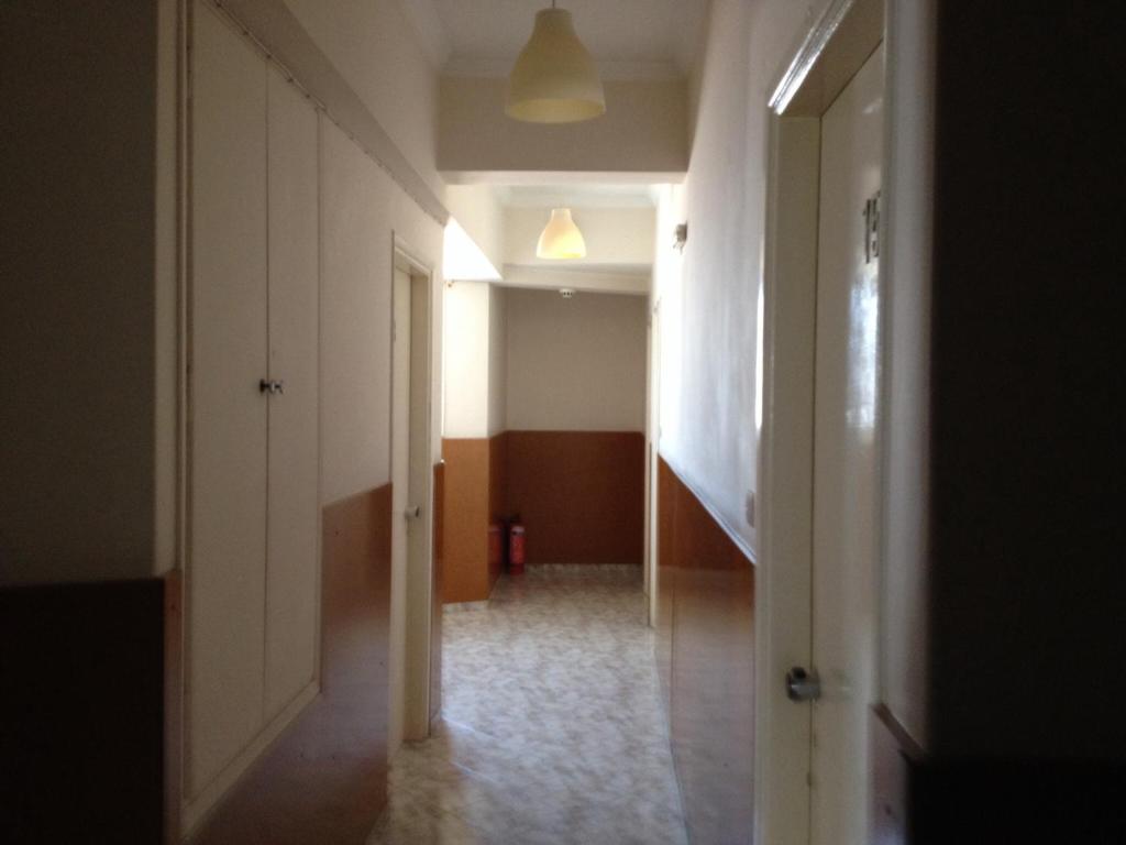 Postel nebo postele na pokoji v ubytování Aegli Hotel