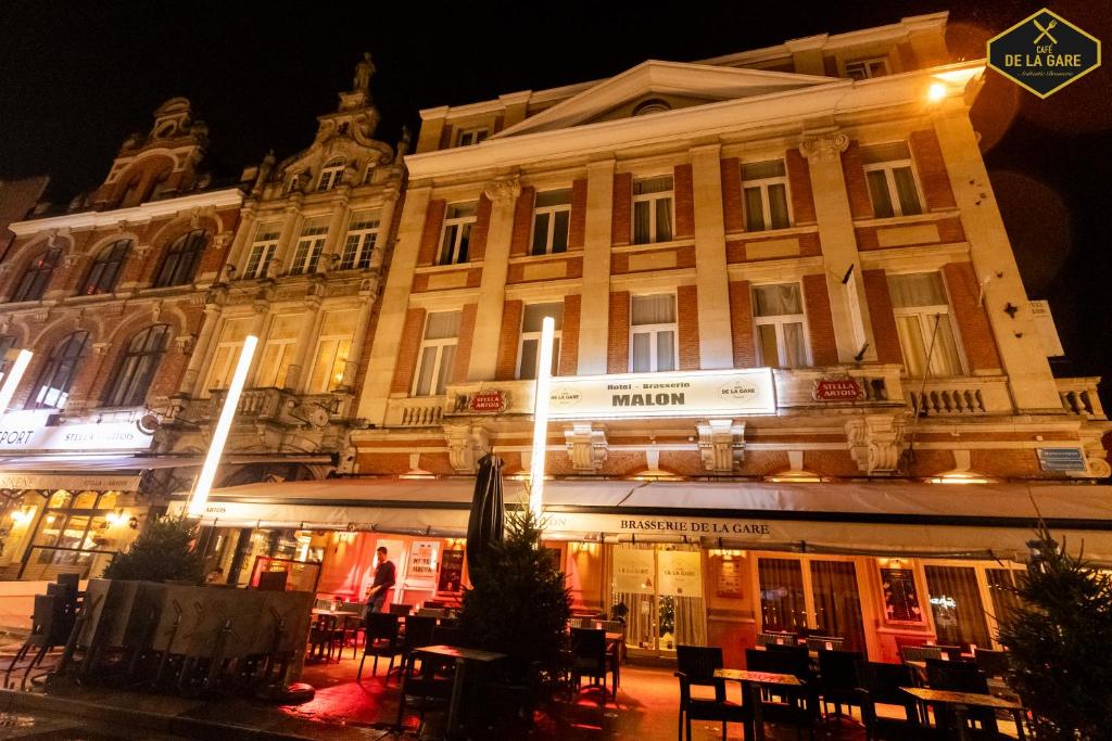 a large building with a street sign in front of it at Hotel Malon in Leuven