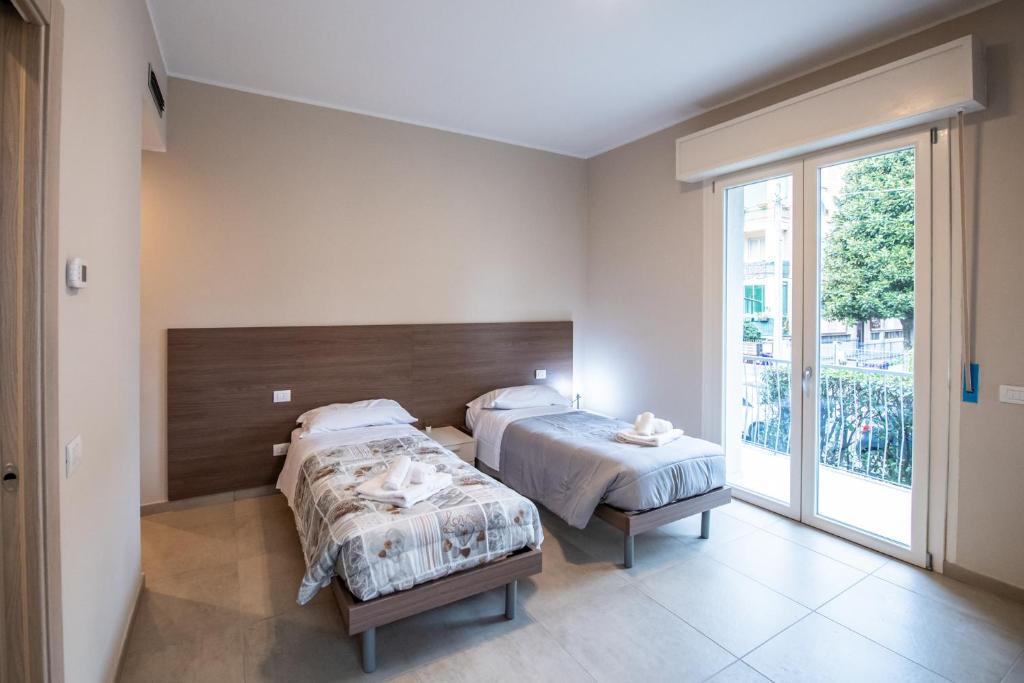Postel nebo postele na pokoji v ubytování Ospedale a 350m Centro a 900m l Matrimoniali con Bagno Privato l Parcheggio Self Check