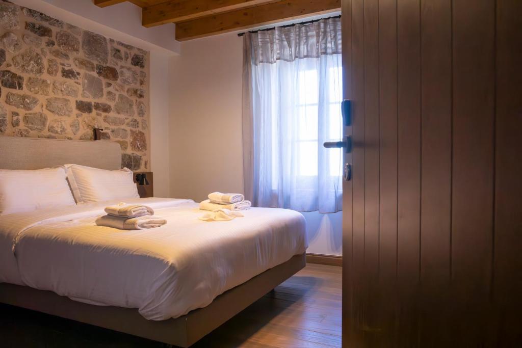 Postel nebo postele na pokoji v ubytování Μikri Arktos Boutique Hotel