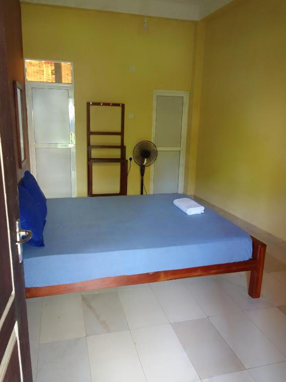 Postel nebo postele na pokoji v ubytování Serene Inn Kandana