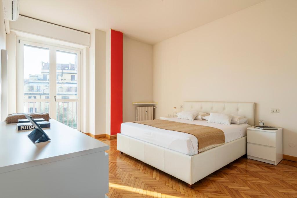 A bed or beds in a room at Conchetta Flexyrent - Aircon - WiFi - Navigli