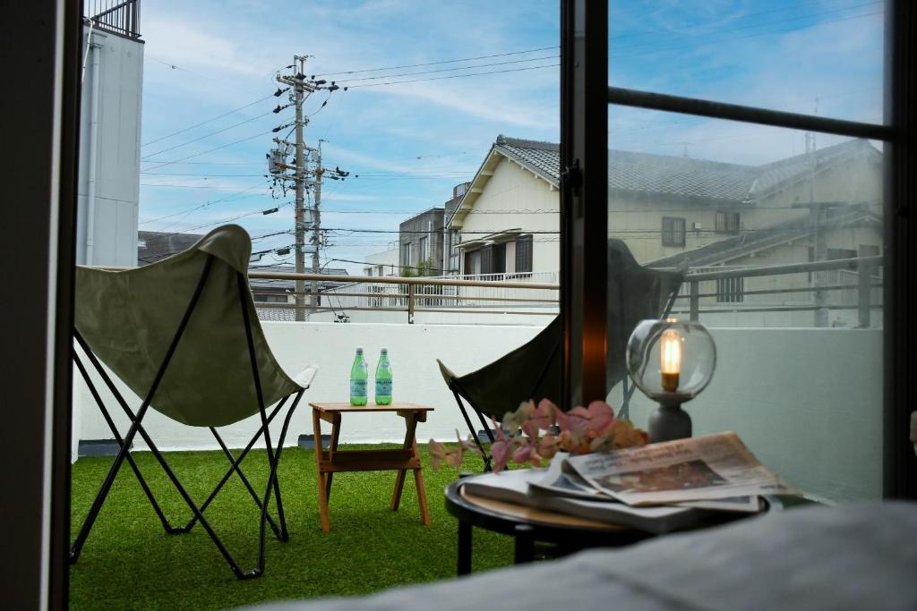 Balkón nebo terasa v ubytování Yokkaichi Guest House
