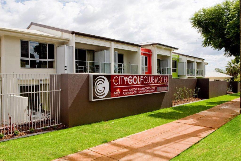 a house with a sign on the side of it at City Golf Club Motel in Toowoomba