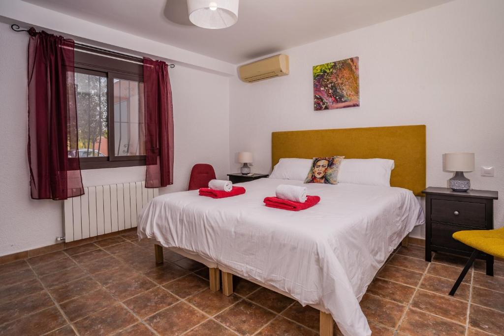 Postel nebo postele na pokoji v ubytování Villa Roja