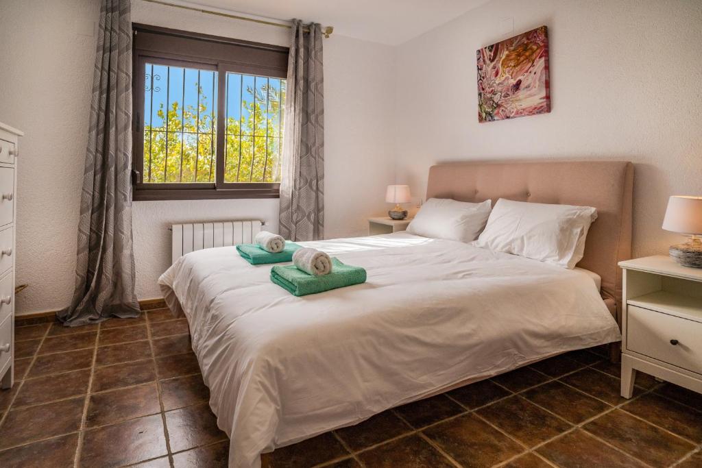 Postel nebo postele na pokoji v ubytování Villa Roja
