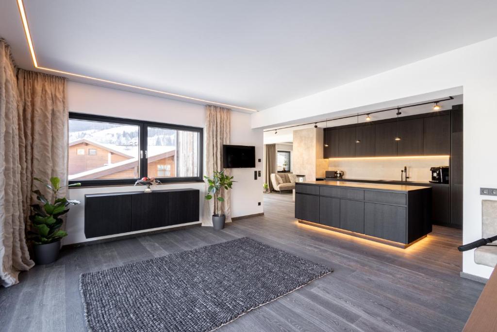 Kuchyň nebo kuchyňský kout v ubytování Penthouse Julia nähe Badesee mit Infrarotsauna -Zell am See Kaprun