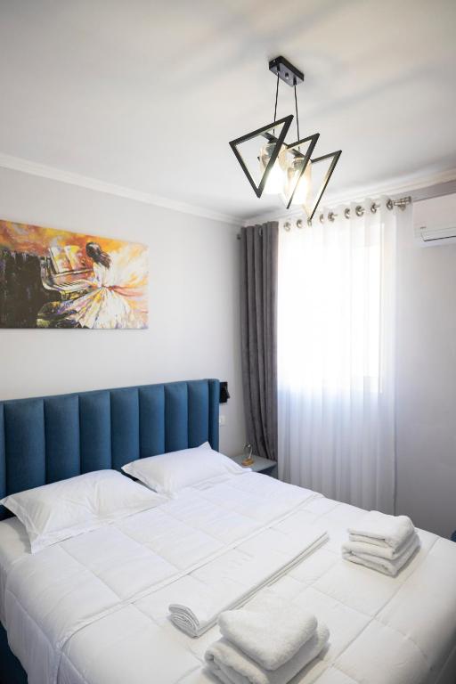 Postel nebo postele na pokoji v ubytování Tier Hotel
