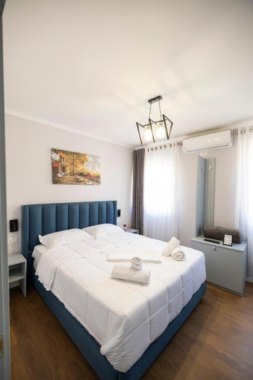 Postel nebo postele na pokoji v ubytování Tier Hotel