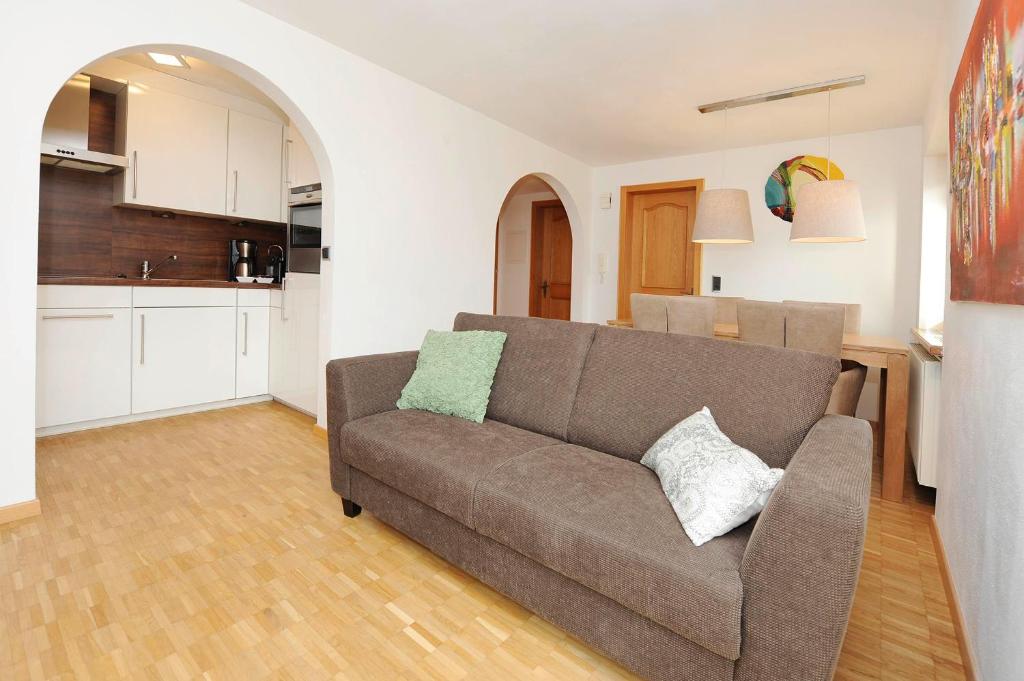 a living room with a couch and a kitchen at Kleiner Turm 02 in Schruns