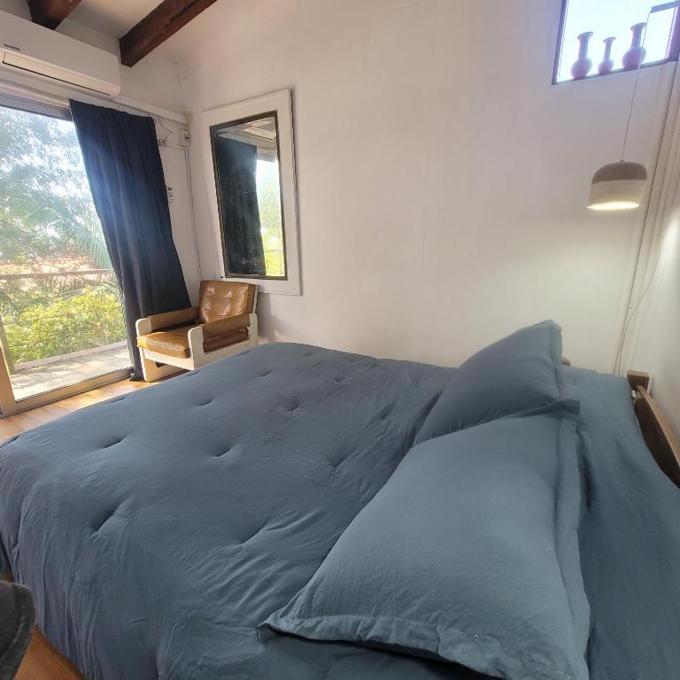 Postel nebo postele na pokoji v ubytování Casa Encantada Guest House