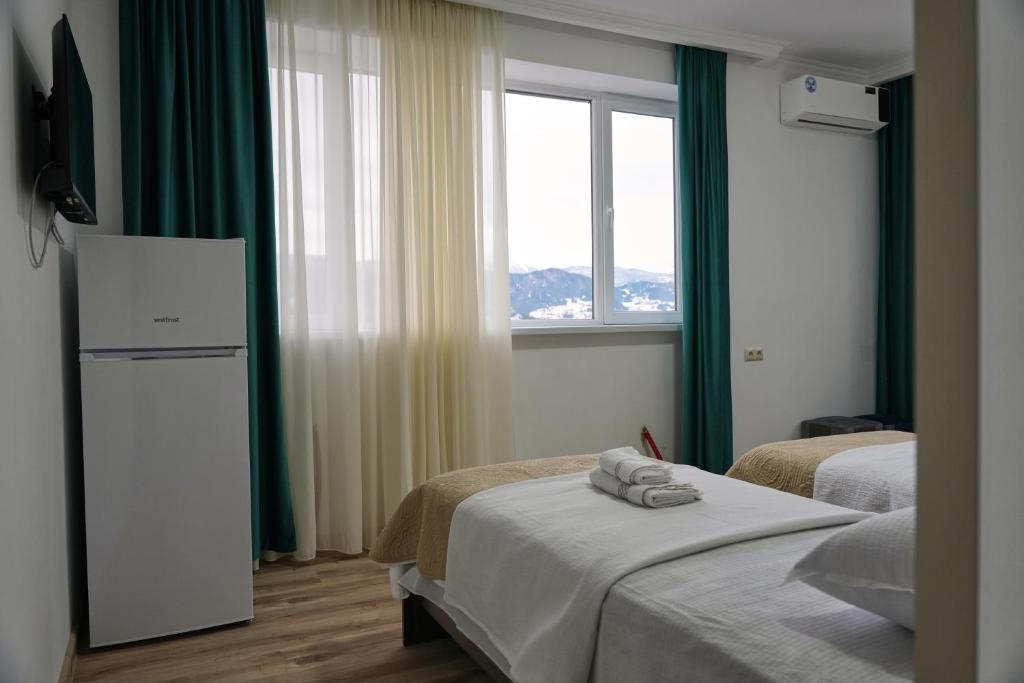Postel nebo postele na pokoji v ubytování Hotel Lile • სასტუმრო ლილე