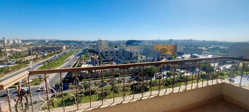 a view of a city from a balcony at Luxury 2 bedroom apartment at the heart of modern Cairo directly on Salah Salem main street in Cairo