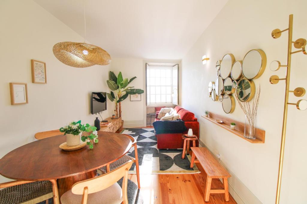 a living room with a table and a couch at Douro Divine in Porto