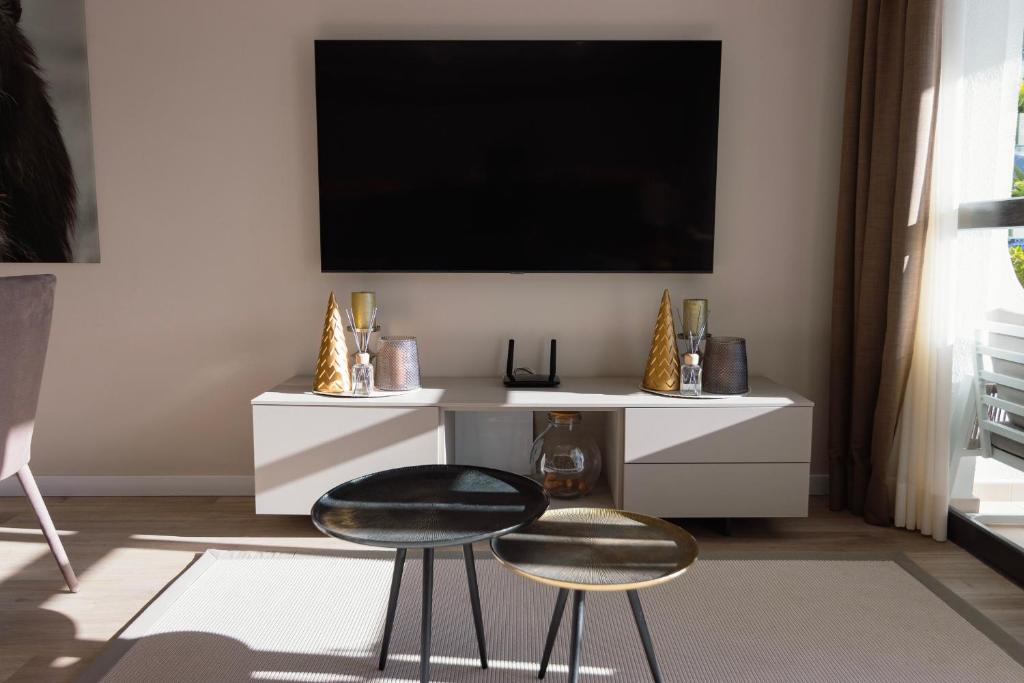 A television and/or entertainment centre at A.M. LUXURY HOME IN PUERTO RICO