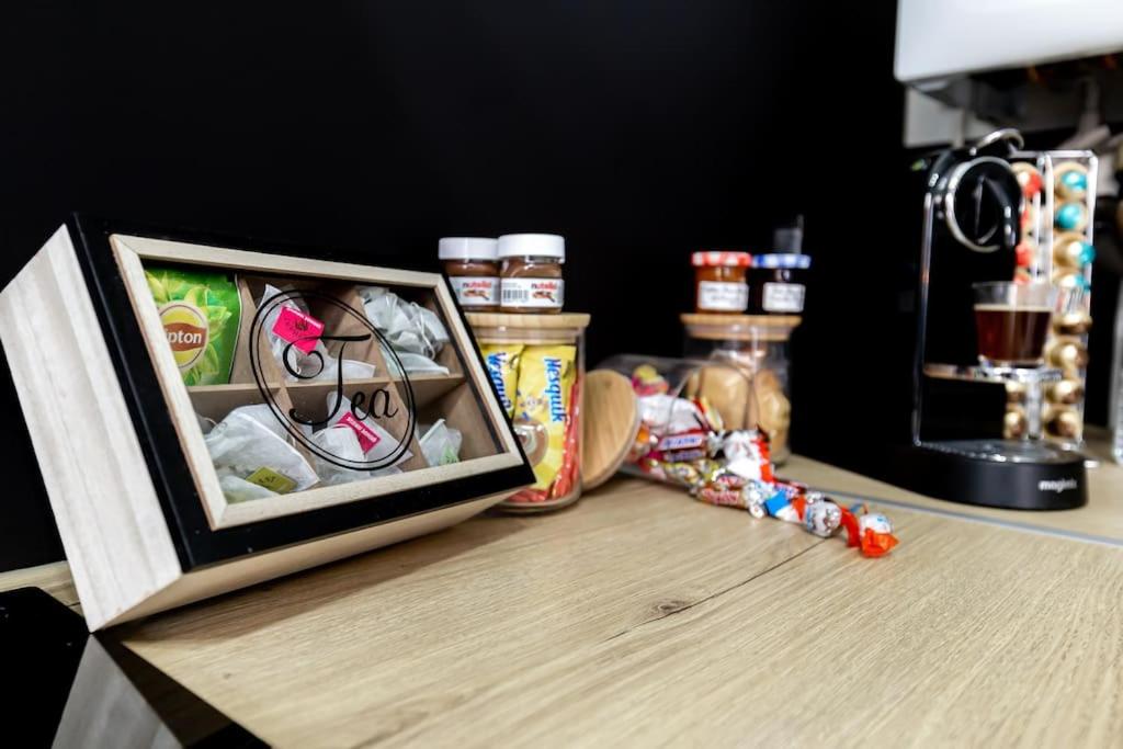 a picture frame sitting on a table with food at Grand &amp; Lumineux T2 au Coeur de Monplaisir • Métro à 2’ • Parking Privé in Lyon