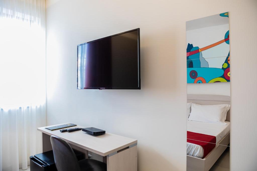 TV a/nebo společenská místnost v ubytování HAPPYROOMS