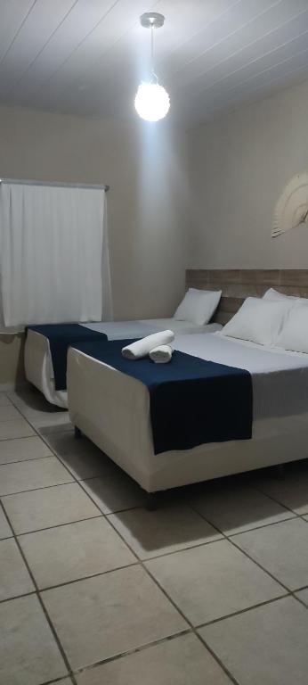 Cama ou camas em um quarto em Pousada Nordestina