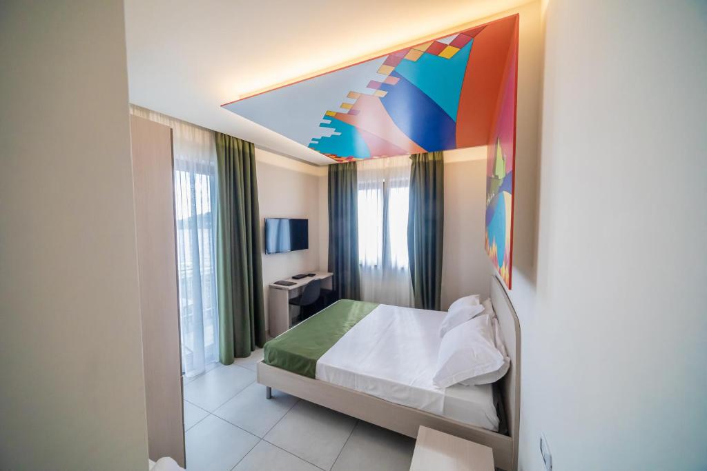 Postel nebo postele na pokoji v ubytování HAPPYROOMS