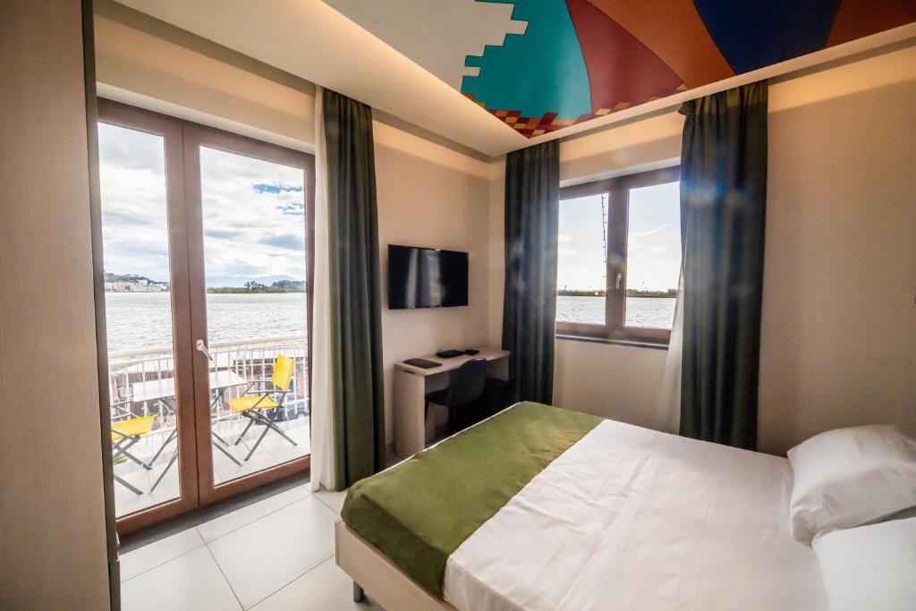 Postel nebo postele na pokoji v ubytování HAPPYROOMS