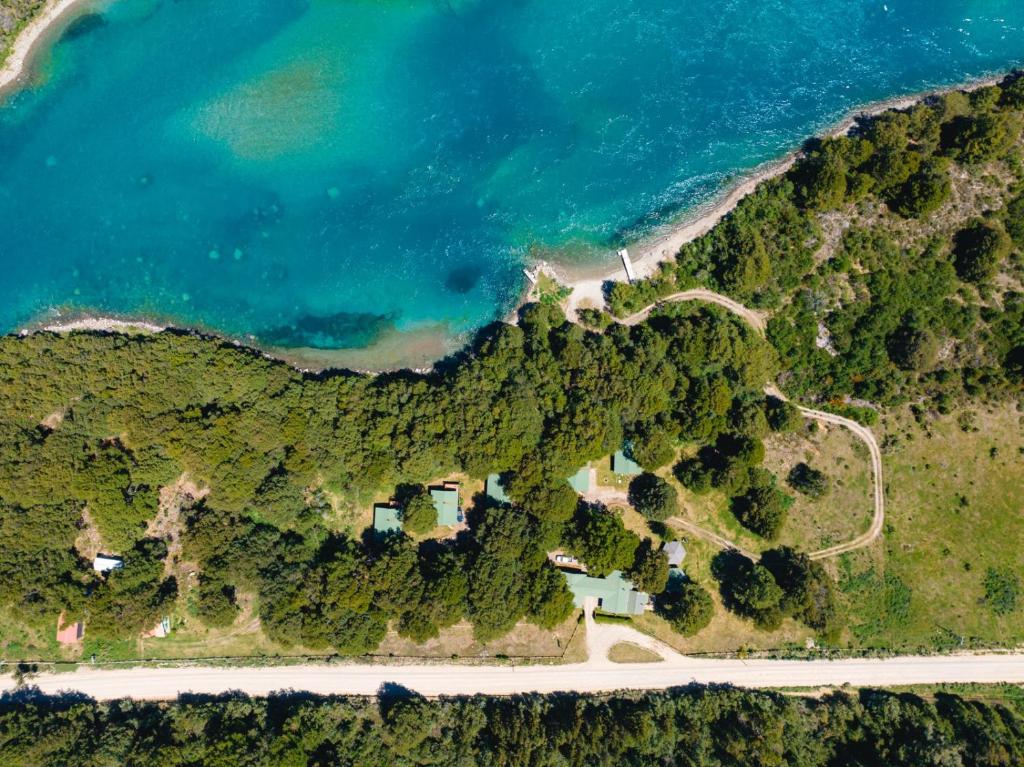 an aerial view of a mountain next to the ocean at Cabañas Rápidos del Río Baker in Puerto Bertrand