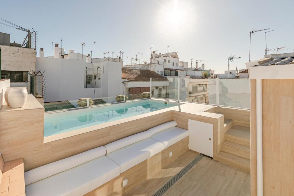 a swimming pool on the roof of a building at ISG Apartments Faustino 45-3 in Seville