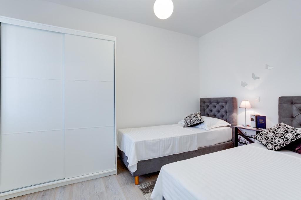 Posteľ alebo postele v izbe v ubytovaní Apartment Melki