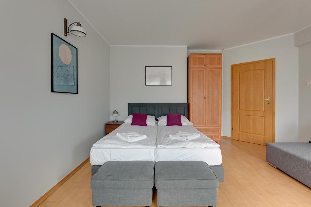 Posteľ alebo postele v izbe v ubytovaní Willa Halina by Grand Apartments