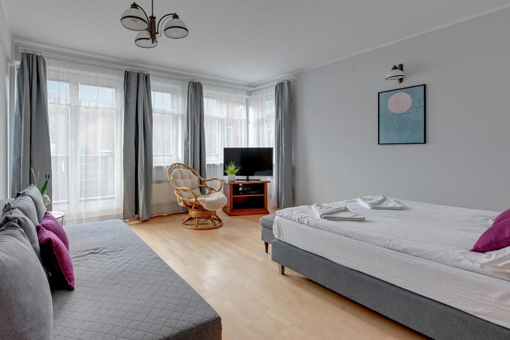Posteľ alebo postele v izbe v ubytovaní Willa Halina by Grand Apartments