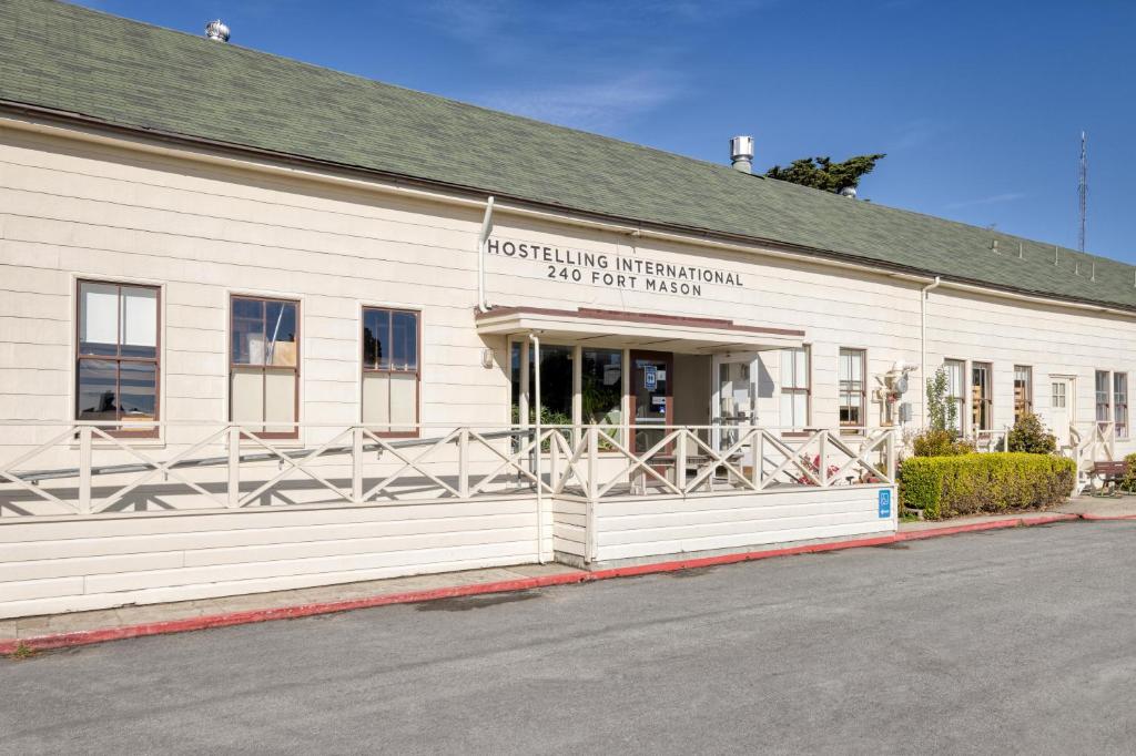 a white building with a sign on the side of it at HI San Francisco Fisherman's Wharf Hostel in San Francisco