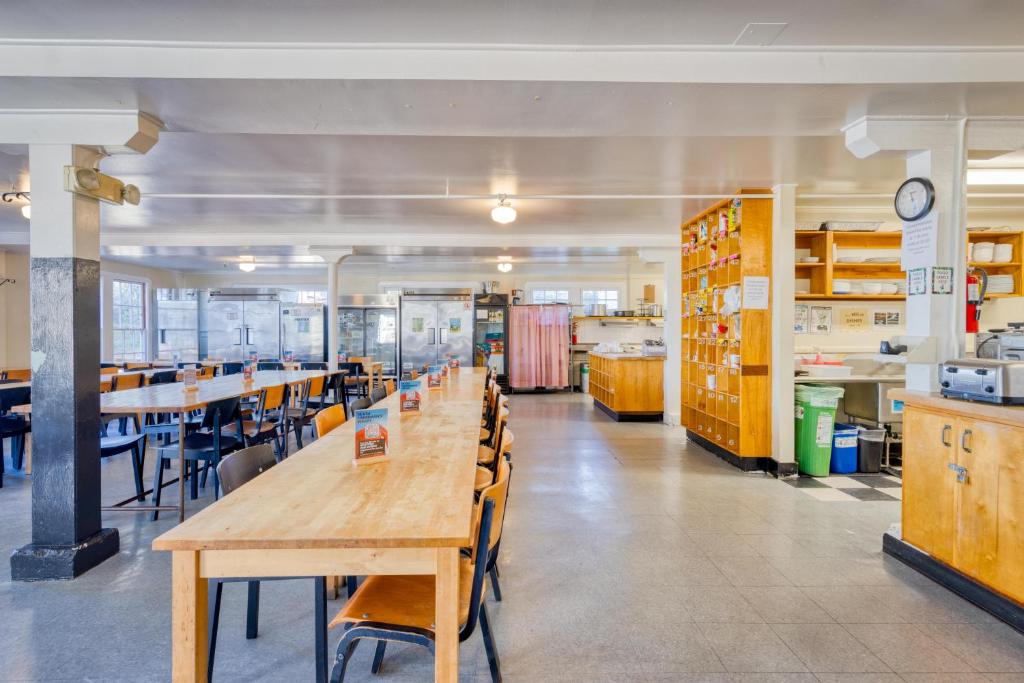 a large room with tables and chairs in a kitchen at HI San Francisco Fisherman's Wharf Hostel in San Francisco