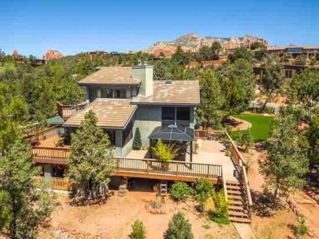 an aerial view of a large house with trees at Uptown Cabin Home with Views HotTub near Trails in Sedona