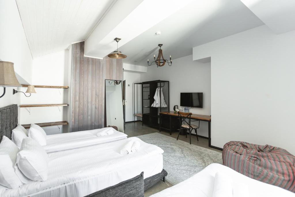 Postel nebo postele na pokoji v ubytování Hotel Roshe Gudauri