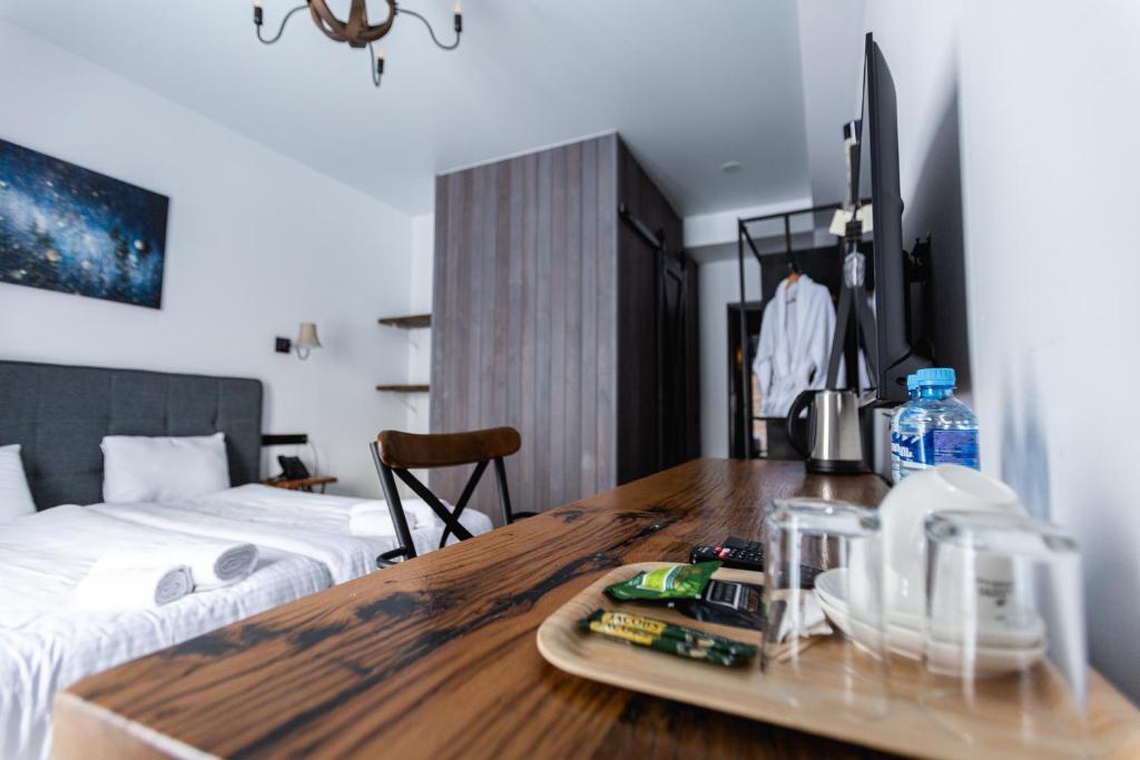 Postel nebo postele na pokoji v ubytování Hotel Roshe Gudauri