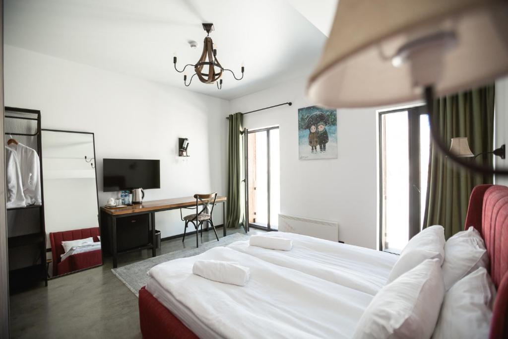 Postel nebo postele na pokoji v ubytování Hotel Roshe Gudauri