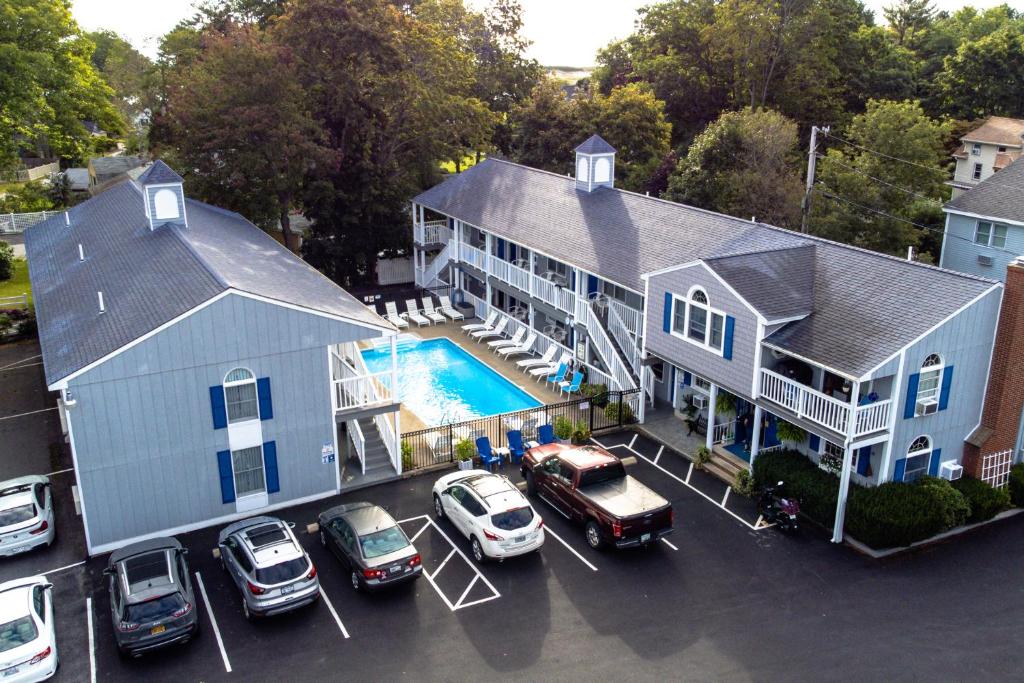 an aerial view of a house with cars parked in a parking lot at Stage Run by the Sea in Ogunquit