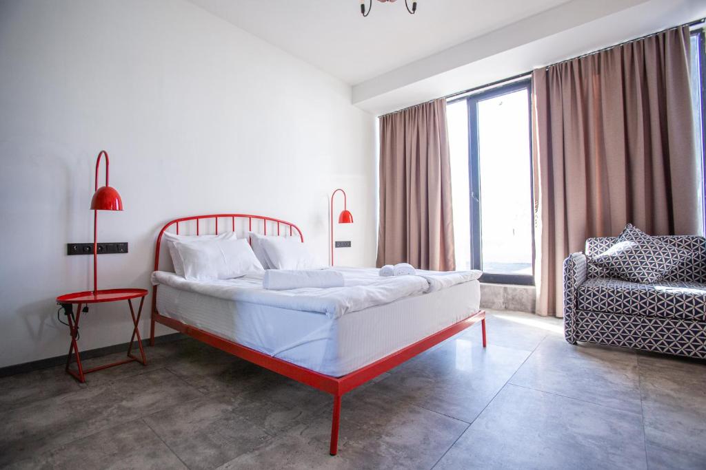 Postel nebo postele na pokoji v ubytování Hotel Roshe Gudauri