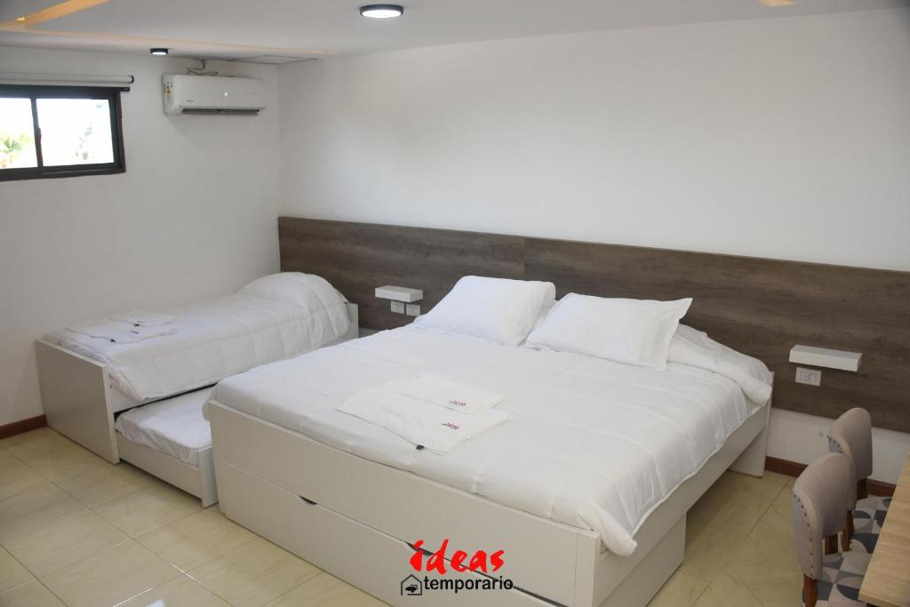 a bedroom with two beds in a room at Ideas Temporarios in Paso de los Libres