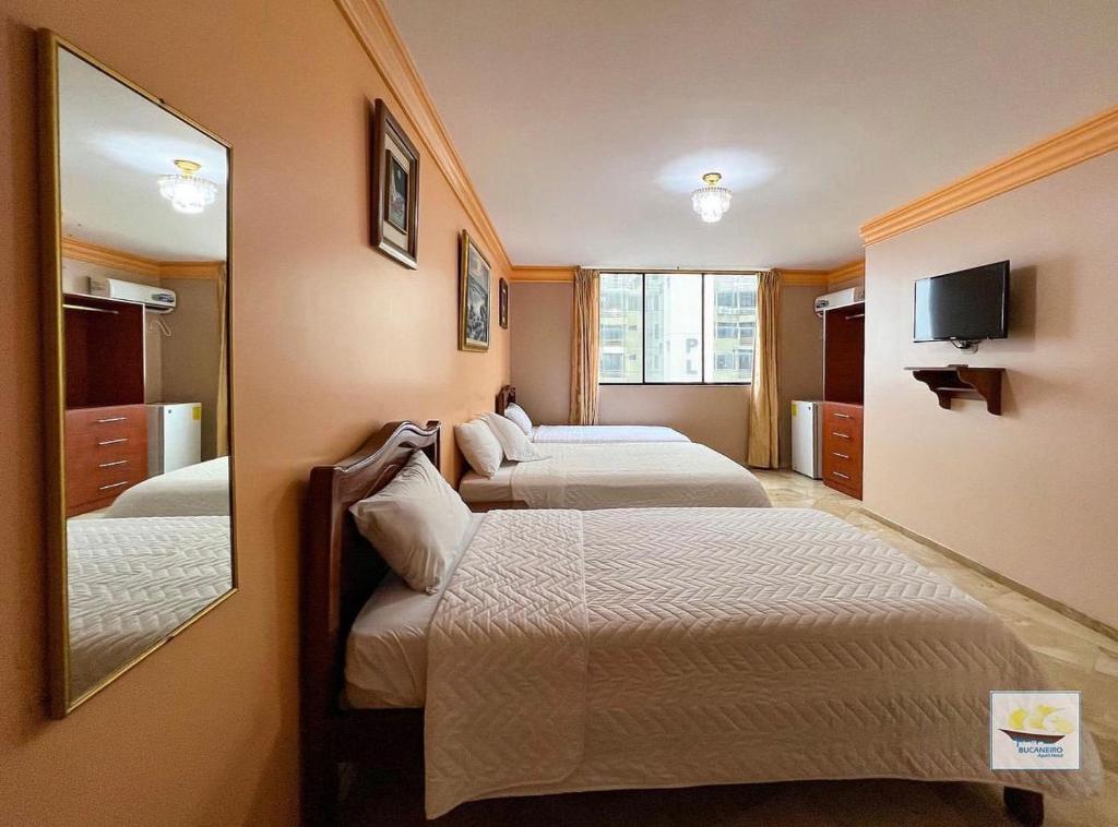 Postel nebo postele na pokoji v ubytování Hotel Bucaneiro
