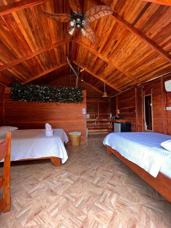 Postel nebo postele na pokoji v ubytování Cabañas SyC