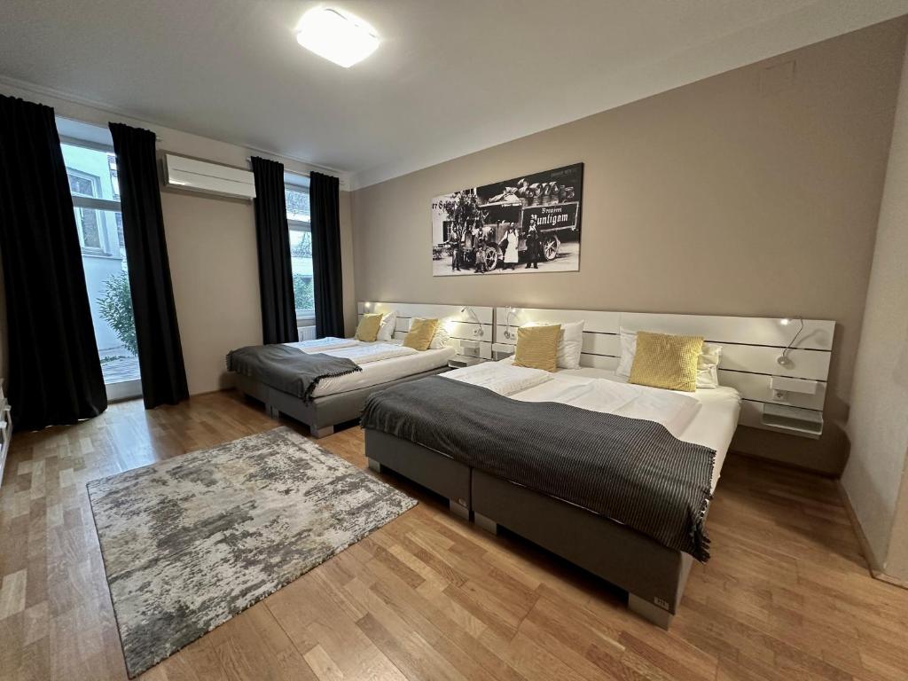 Postel nebo postele na pokoji v ubytování Hotel Brauhof Wien