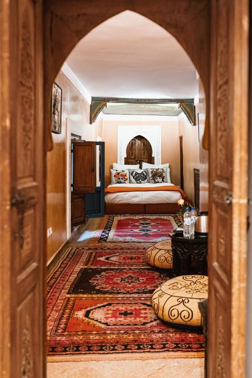Postel nebo postele na pokoji v ubytování Riad Dar Alhambra